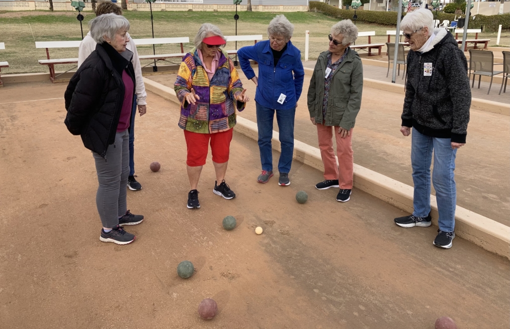 A group plays Bocce Ball