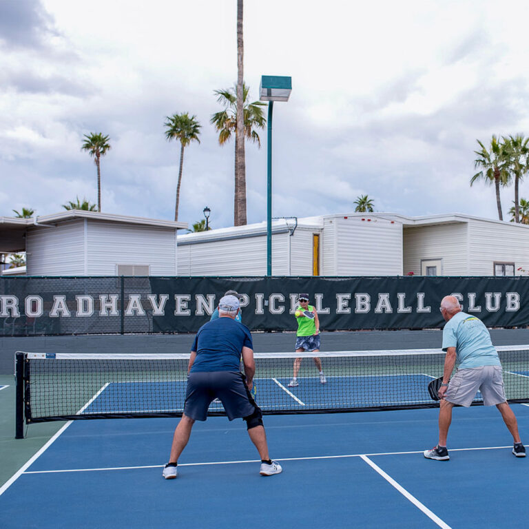 Residents playing pickleball at Roadhaven