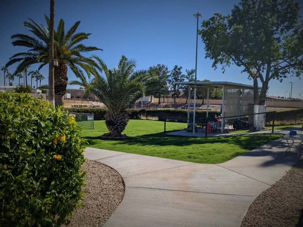 View of the Roadhaven Dog Park from the concrete walking path